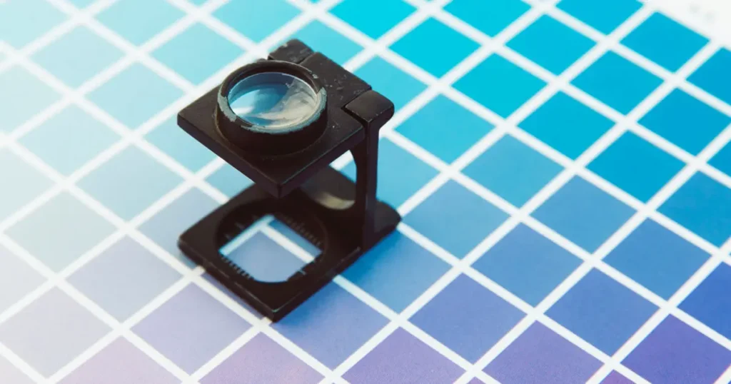 Magnifying glass on a colour chart