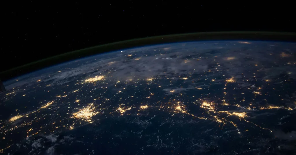 Nasa photo of earth from space. Taken at night time so you can see a network of lights across the surface of earth
