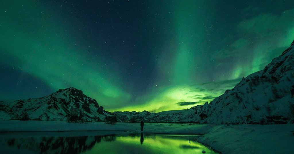 Green aurora borealis illuminating night sky in Thórsmörk Iceland symbolising purpose-driven business vision. Photo by Jonatan Pie on Unsplash