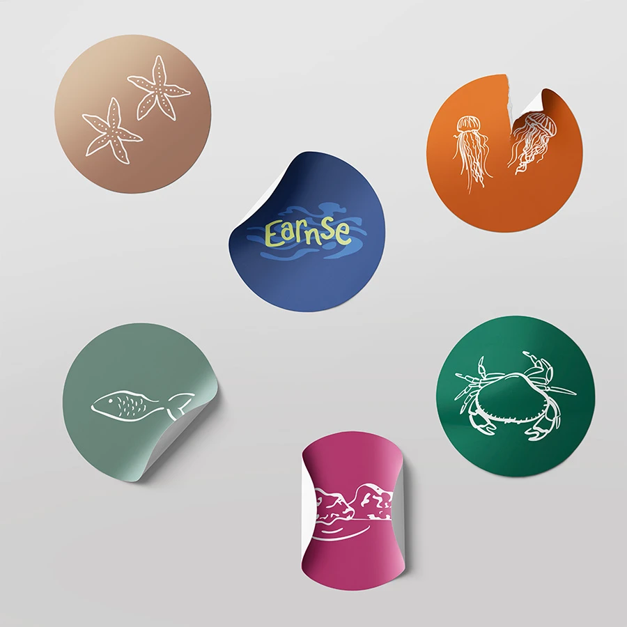 Earnse brand design stickers with colourful graphics representing marine life from the beach school